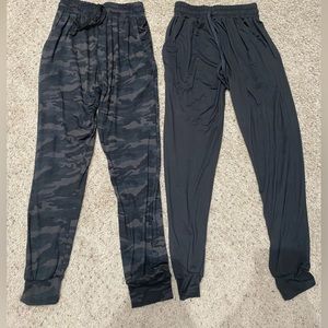 two womens joggers from the brand real essentials, they are both a size small.